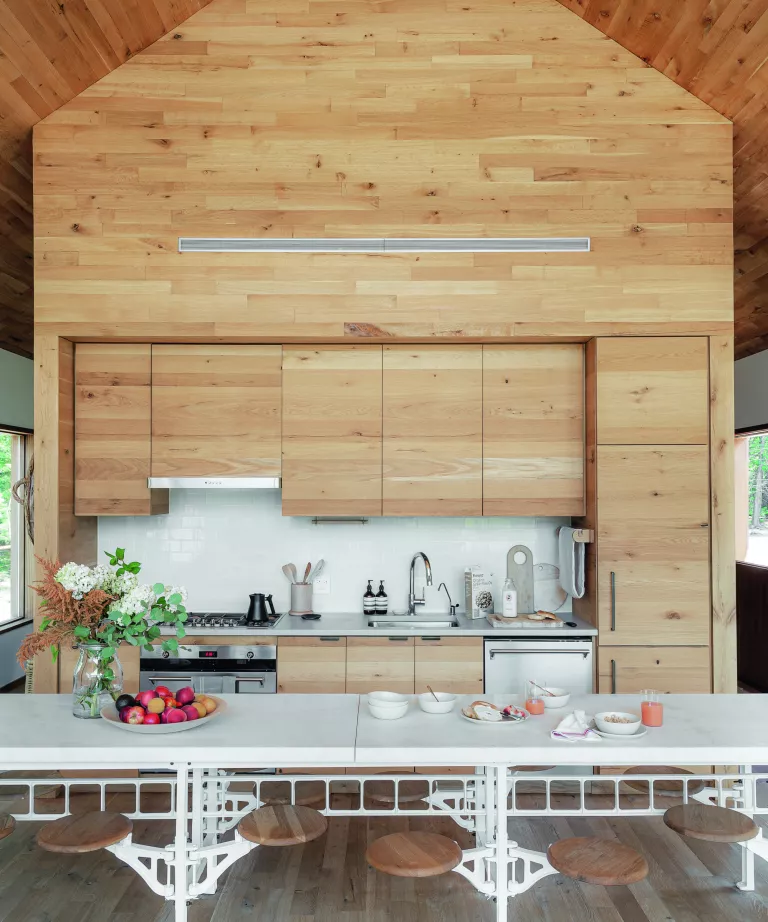 This sustainable woodland cabin has a calm and elegant modern country interior