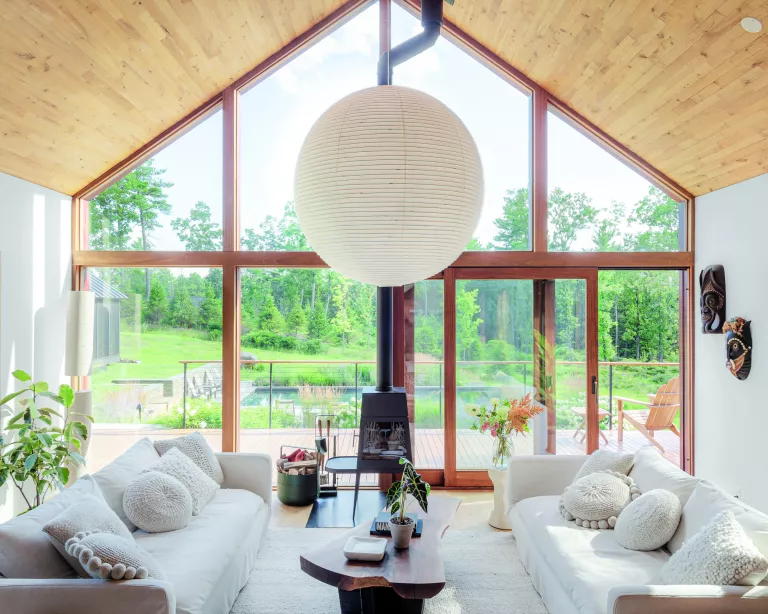 This sustainable woodland cabin has a calm and elegant modern country interior