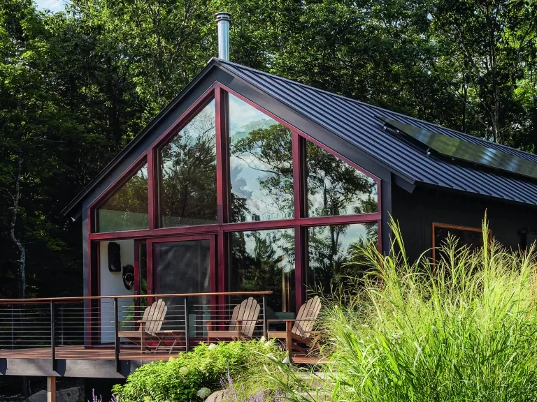 This sustainable woodland cabin has a calm and elegant modern country interior