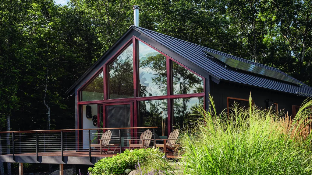 This sustainable woodland cabin has a calm and elegant modern country interior